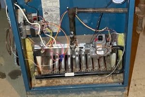 Dakota Norris 2 furnace without cover showing pilot light